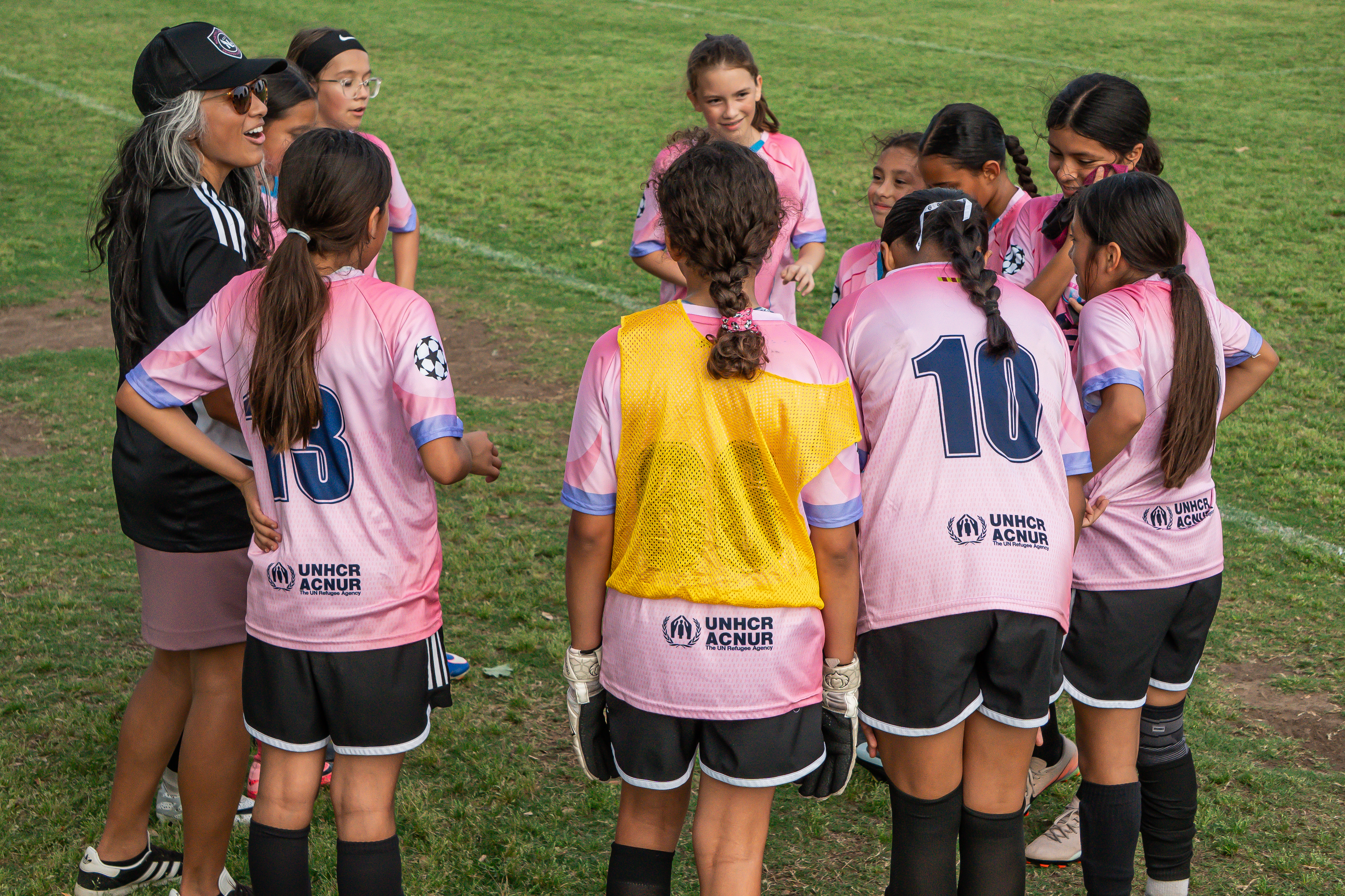 Coach Jen Bruehl speaking with North Lakes FC players